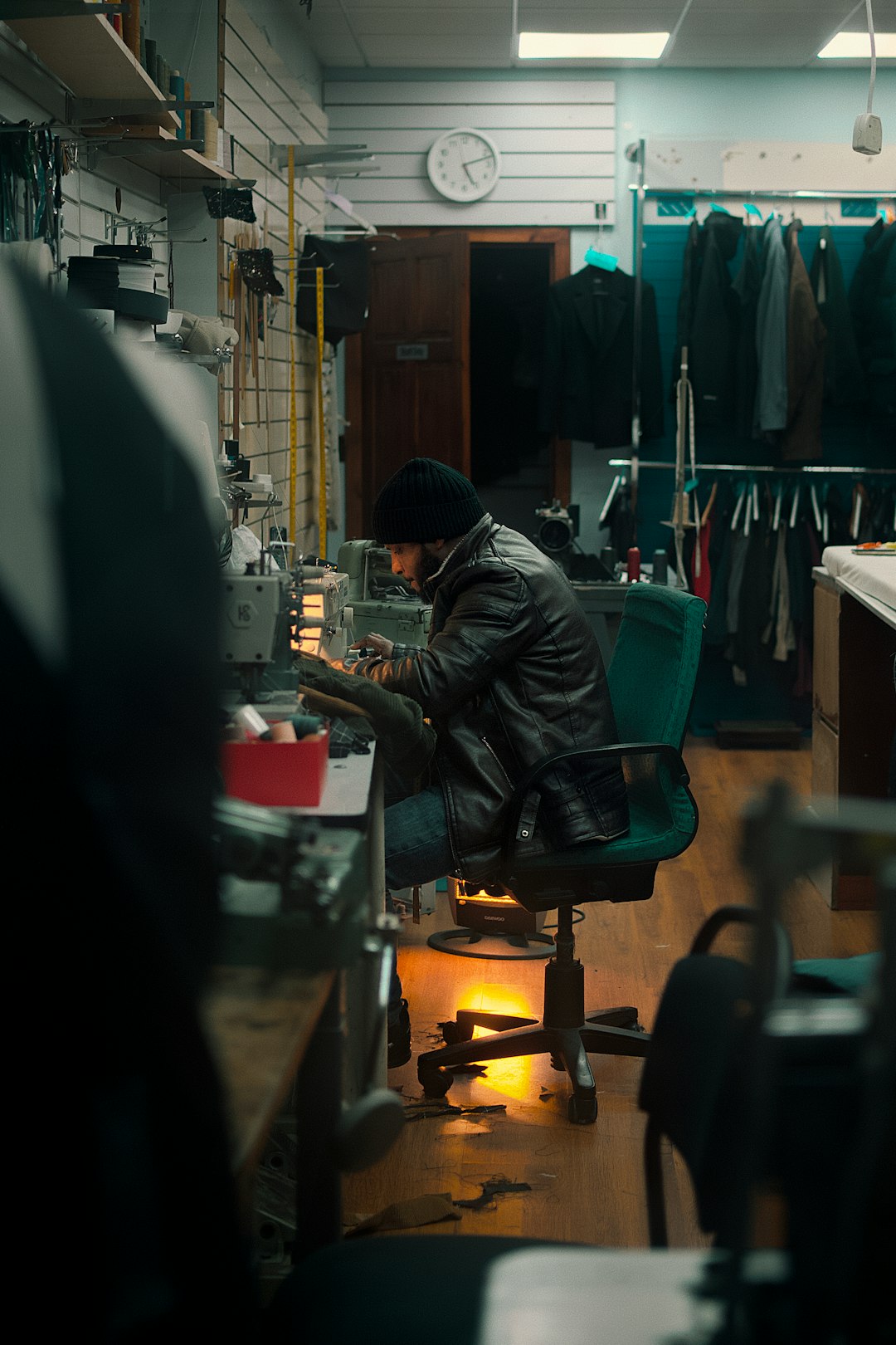 man-working-at-a-sewing-machine-in-a-workshop-oehwn3tekui